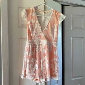 Pink Lily pale pink and lace romper.